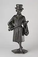 Figure B: Albrecht of Bavaria (d. 1404) holding a staff. He wears a fur hat and a houppelande with fur trimmings.