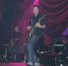 Whyte playing guitar at a Morrissey concert at the Roseland Ballroom in New York City, 2000