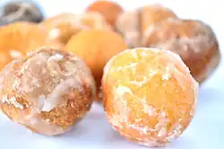 A variety of powdered and glazed donut holes