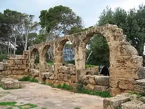 Several arches of a ruined building.