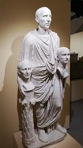 The so-called "Togatus Barberini", a statue depicting a Roman senator holding portrait effigies (possibly imagines) of deceased ancestors; marble, late 1st century BC; head (not belonging): mid 1st century BC.
