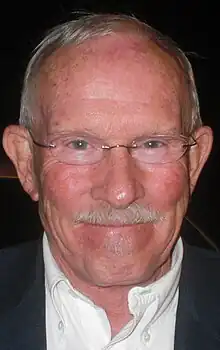 Head shot of Tom Smothers outdoors at night