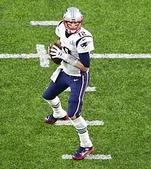 Brady stepping back to pass