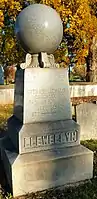 Tombstone topped with orb symbolizing a celestial body and the reward of resurrection, churchyard of St. Peter's Church in the Great Valley, Malvern, Chester County, Pennsylvania