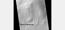 Tongue-shaped glacier, as seen by HiRISE under the HiWish program.  Ice may exist in the glacier, even today, beneath an insulating layer of dirt.  Location is Hellas quadrangle.