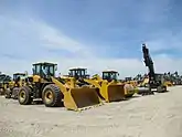 Large wheel loader trucks parked