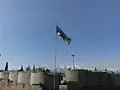 The regimental flag of the Cameron Highlanders of Ottawa flies above a NATO installation near Tora Bora in Afghanistan