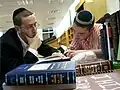 A Torat Shraga Rabbi learning with a student