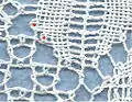 Torchon lace: two pins (red dots) connect two pairs of the ground with the motif