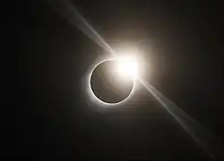 Diamond ring effect visible during the total solar eclipse of August 21, 2017, in Ravenna, Nebraska. (The diffraction spikes emanating tangentially from the diamond are an artifact of the camera optics, not a natural phenomenon.)