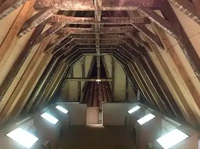 The top room under the roof, with some of the original roof beams