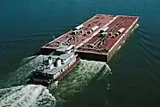 Towboat Ben McCool upbound on Ohio River at Matthew E. Welsh Bridge with two tank barges (5 of 6), near Mauckport, Indiana, USA, 1987