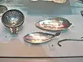 Traprain Law Treasure. Silver strainer and bowls of silver spoons.