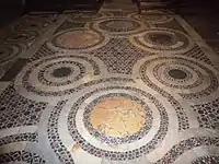Cosmatesque floor, from the Chiesa di San Benedetto in Piscinula, in the Trastevere section of Rome.