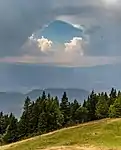 Hole in a cloud over Karawanks, Slovenia.