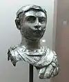 Unknown young man head wearing a scale breastplate