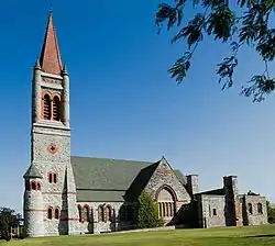 Romanesque church with an orange spire