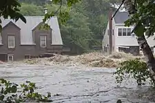 Flood waters from Tropical Storm Irene on the Ottauquechee River in Quechee, Vermont.