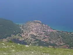 Red-roofed village on an outcrop by the lakeshore