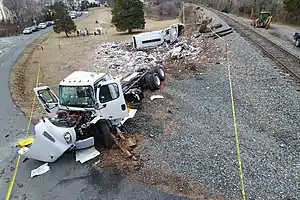 Aftermath of the crash with the trash strewn about the accident site.