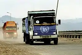 Trucks loaded with supplies drive across the border from Turkey into Iraq to take part in Operation Provide Comfort, a multinational effort to aid Kurdish refugees