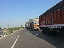 Trucks on the former Indian National Highway 1, waiting to cross the border at Wagah–Attari.