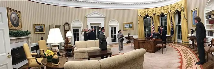 A panoramic view of the Oval Office, January 26, 2017. President Donald Trump is seated at the Resolute desk.
