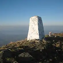 Border stone on the tripoint of Bulgaria (right of photograph), Greece (left), and North Macedonia, located on the Tumba Peak