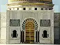 Main door of the mausoleum, made out of teak, with inscriptions in Arabic saying "the supreme fighter, builder of modern Tunisia, liberator of women