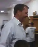 A picture of Ty Detmer wearing a button down.
