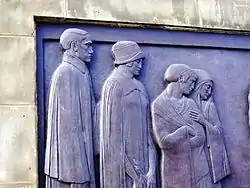 Part of relief on Liverpool Cenotaph. Some of the mourners.