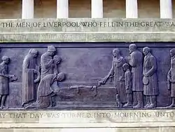 Part of relief on Liverpool Cenotaph. Mourners gather round a coffin.