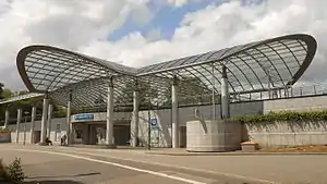 Transparent curved roof covering station building