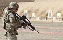 A U.S. soldier of the 1st Aviation Regiment holding a G36