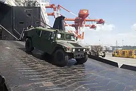 A humvee unloads from the ship during Exercise Freedom Banner 2013