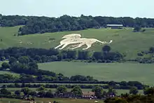 Figure of a lion cut into the hillside: the Whipsnade Zoo lion near Whipsnade