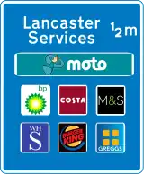 Approach sign to motorway service area listing operator and six franchises available at the stop. These are the only signs allowed to display brand logos.