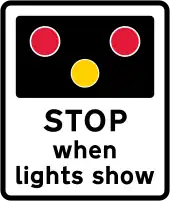 Warning of light signals at a level crossing ahead (the sign may also be used at a lifting bridge, fire station or airfield)