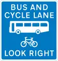 Contra-flow bus lane which pedal cycles may also use with traffic approaching from the right (reminder for pedestrians)