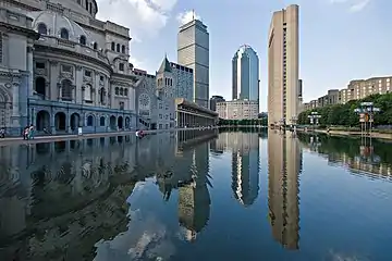 Reflecting pool with high-rises in the background