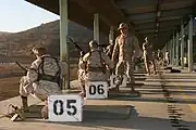 A USMC marksmanship instructor wearing an elephant hat at a firing range at Marine Corps Air Station Miramar in 2009