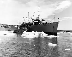 The USNS General A.W. Greely (T-AP-141) alongside the USS LSM-397 amid the ice at Thule, Greenland, during Operation "Blue Jay", 19 July 1951