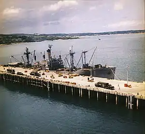USNS Pvt Francis X. McGraw (T-AK-241) loading chemical weapons at Tengan Pier, Okinawa during Operation Red Hat in September 1971. Operation Red Hat involved removing chemicals stored on Okinawa to Johnston Atoll.