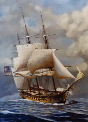 A painting of a sailing ship at sea. The ship has two masts and the sails are reefed while firing upon with another ship. The ship is sailing toward lower right hand corner of the frame.