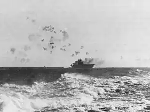 The aircraft carrier USS Enterprise (CV-6) under aerial attack during the Battle of the Eastern Solomons