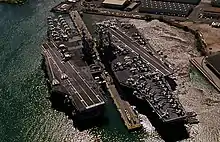Independence, left, a Forrestal-class carrier next to Kitty Hawk (right)