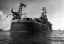 USS Oklahoma City (CL-91) stern with SC Seahawks c. 1945