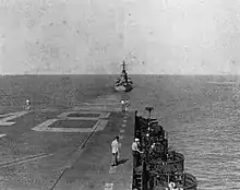 USS Oregon City (CA-122) tows USS Saipan (CVL-48) in the Caribbean Sea, in 1947