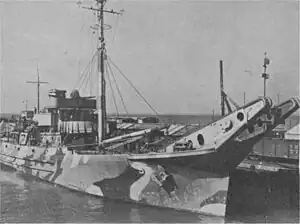 The US Navy wooden Net Tender, USS Terebinth (AN-59) in wartime camouflage.
