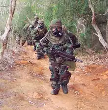 Soldiers evaluate the performance of MOPP 4 gear at a TRTC site in Hawaii.